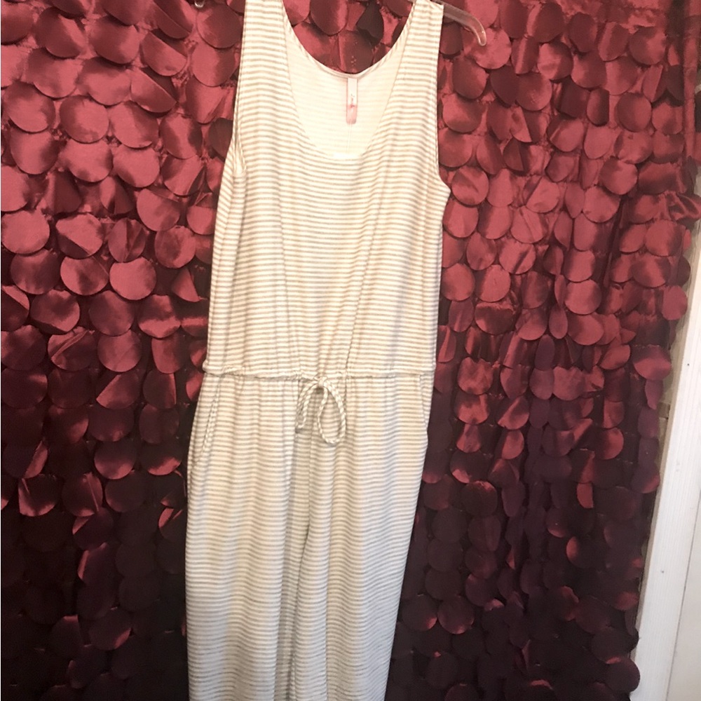 Gray/white striped romper! NWT great for the spring time.Short sleeve/pants Sz L